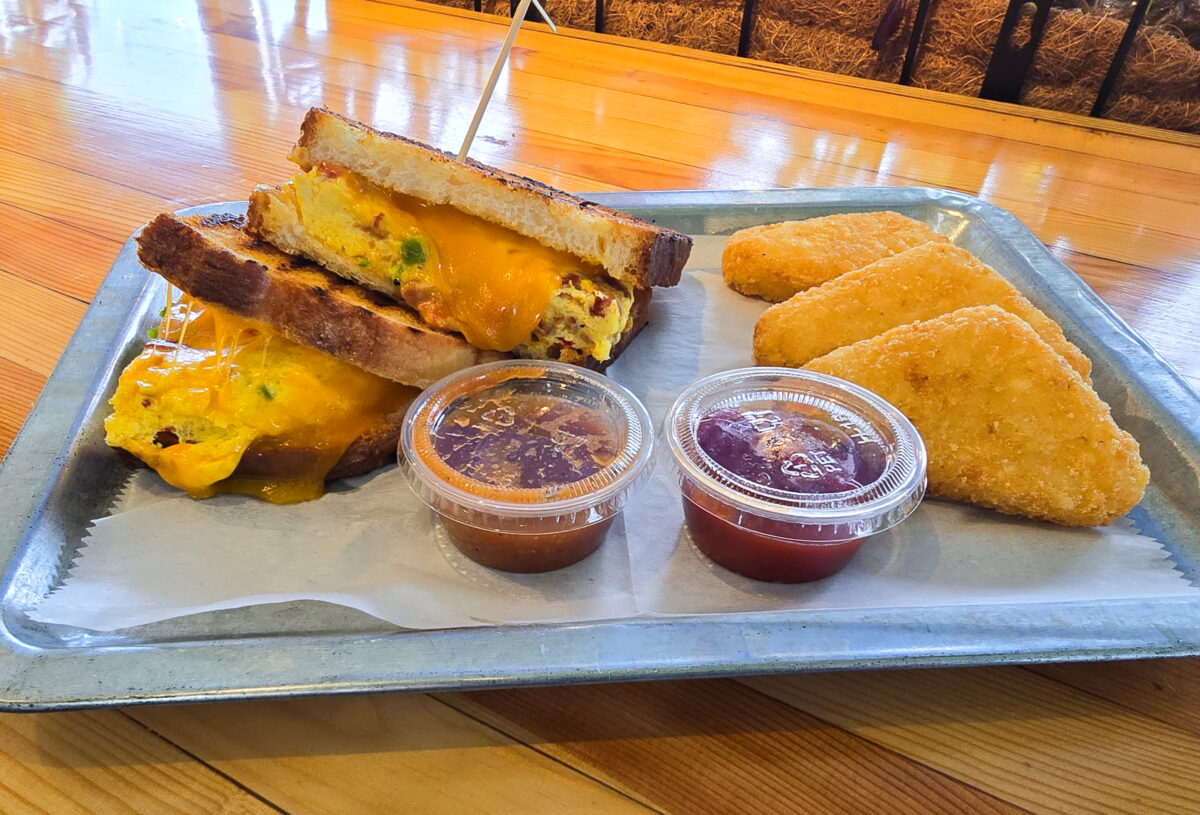 Miss Daisy's Breakfast Egg Sandwich on a Sourdough Panini with Golden Hash Browns