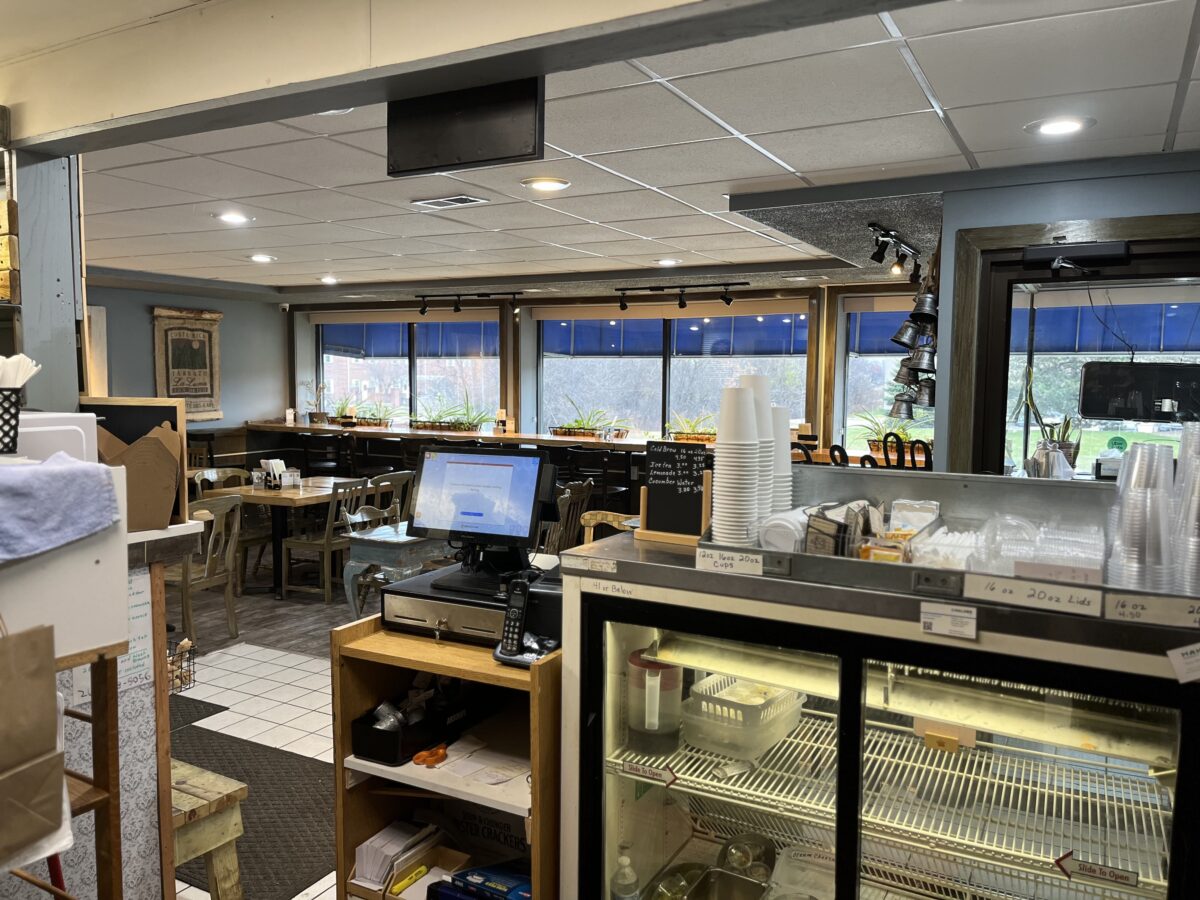 Wide view of the Miss Daisy's dining room looking toward the sunny windows and booths.